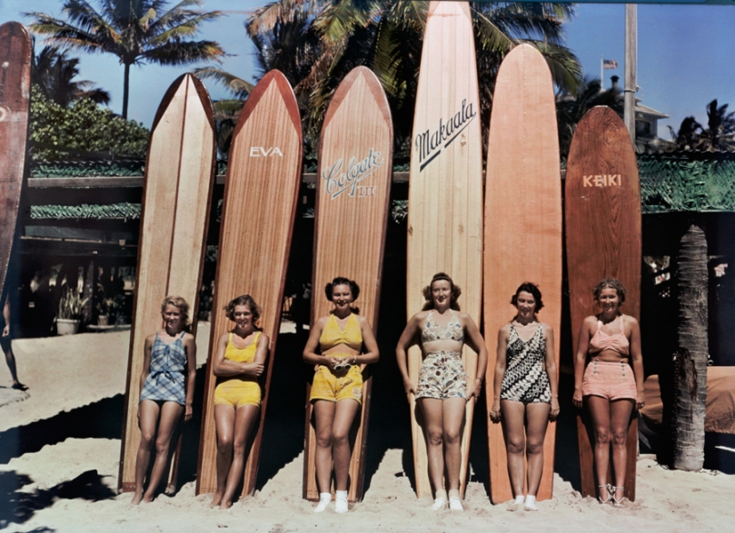 Women pose in front of their surfboards on Waikiki beach in Honolulu, November 1938